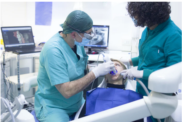 a dentist treating a patient
